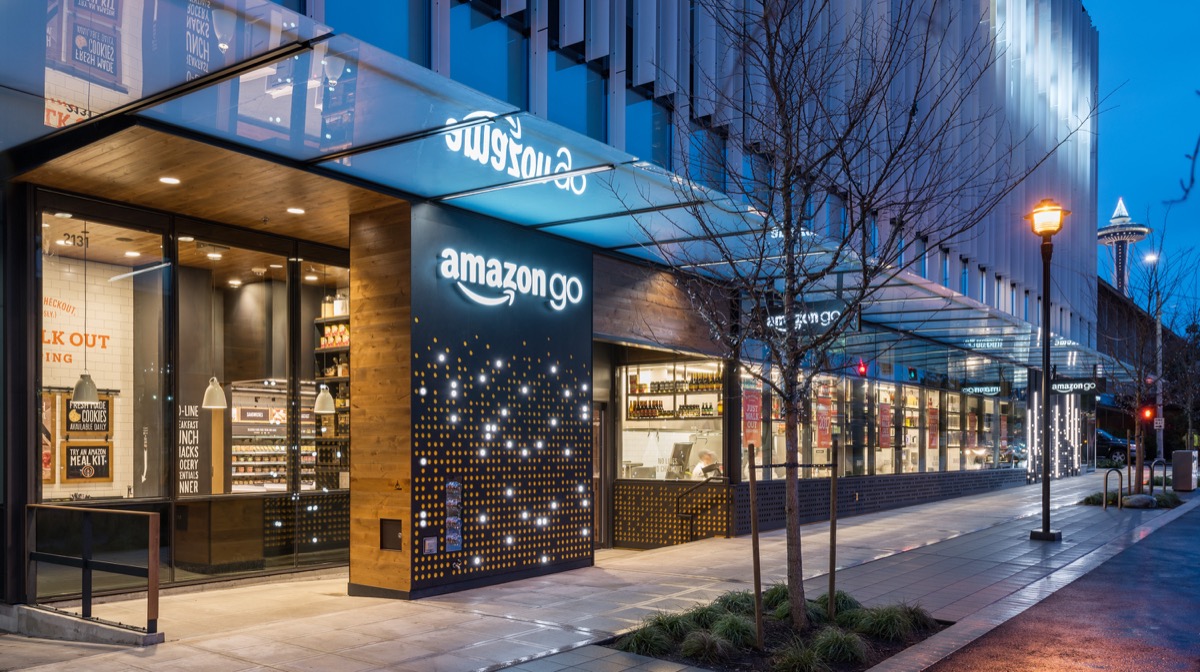 Amazon Go storefront with its orange sign and glass entry